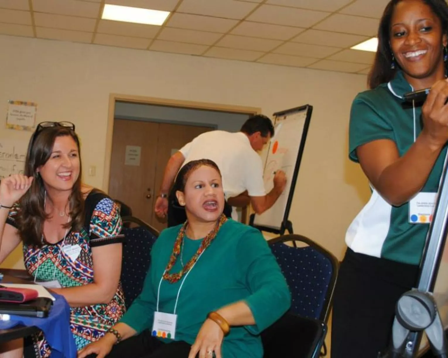 Educators work on a chart at a workshop.