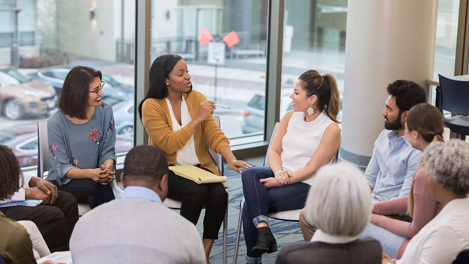 photos of educators in a circle collaborating in a meeting